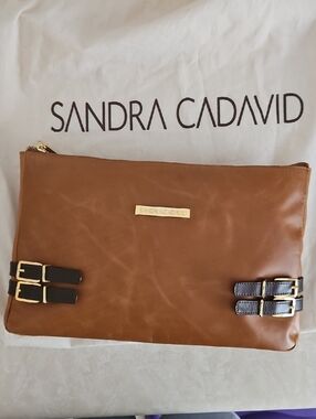 Sandra Cadavid Leather Clutch with Buckle Accents.
